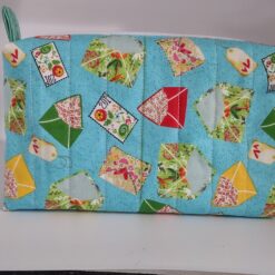Handmade boxy zipper bag made with Envelopes fabric